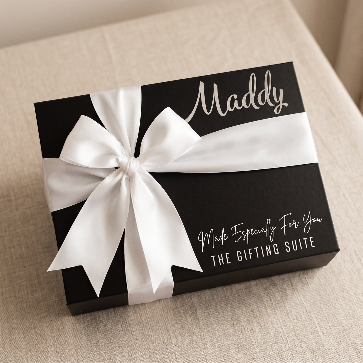 Black personalised gift box with white ribbon and custom name
