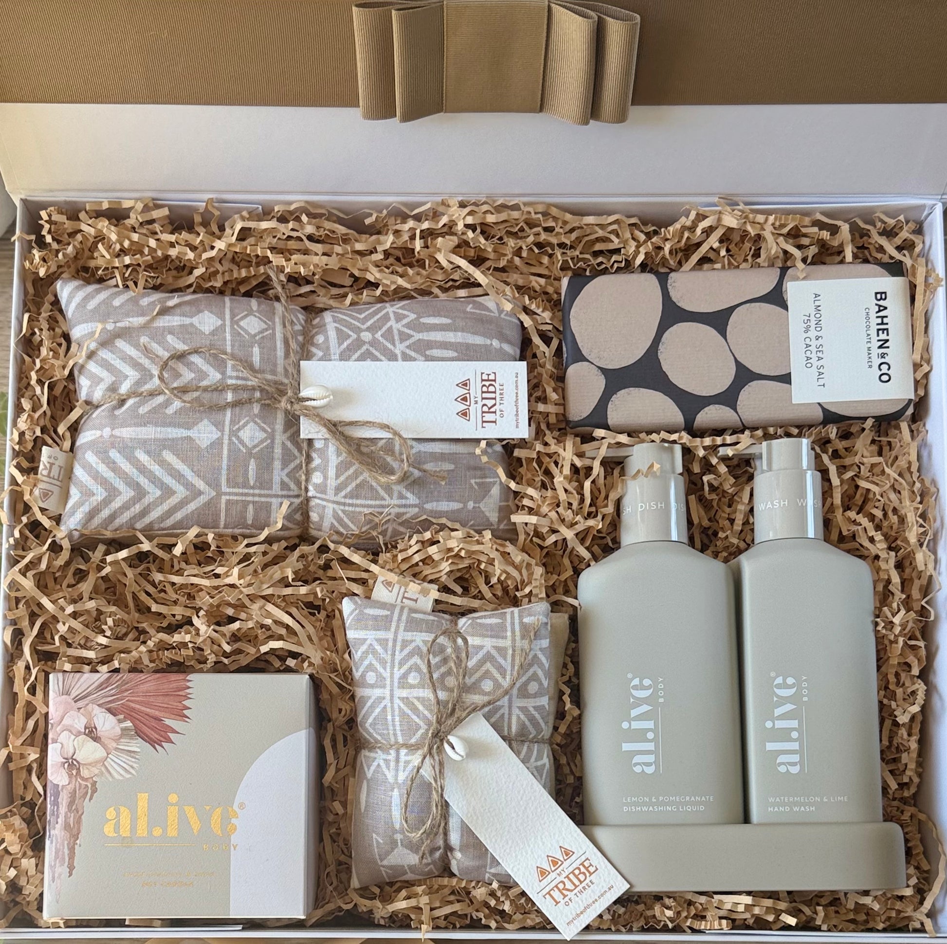 Luxury gift box with al.ive body duo, soy candle, Bahen & Co chocolate, heat pack, and eye mask – The Indulgence Edit by The Gifting Suite