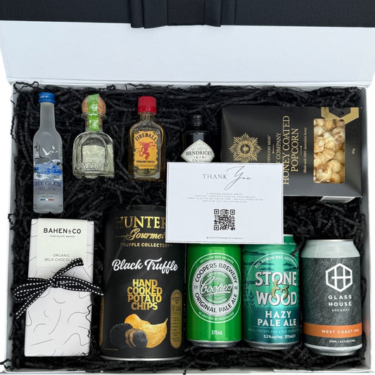 The Weekender gift box featuring mini spirits (Grey Goose, Patrón, Fireball, Hendrick’s), craft beers, Bahen & Co chocolate, truffle chips, gourmet popcorn and a personal video message QR card, perfect for him, birthdays or celebrations
