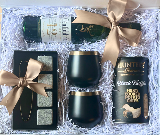 Luxury gift box with Glenfiddich whisky, truffle chips, black whiskey glasses, whiskey stones, and gold ribbon – The Gentleman’s Suite by The Gifting Suite