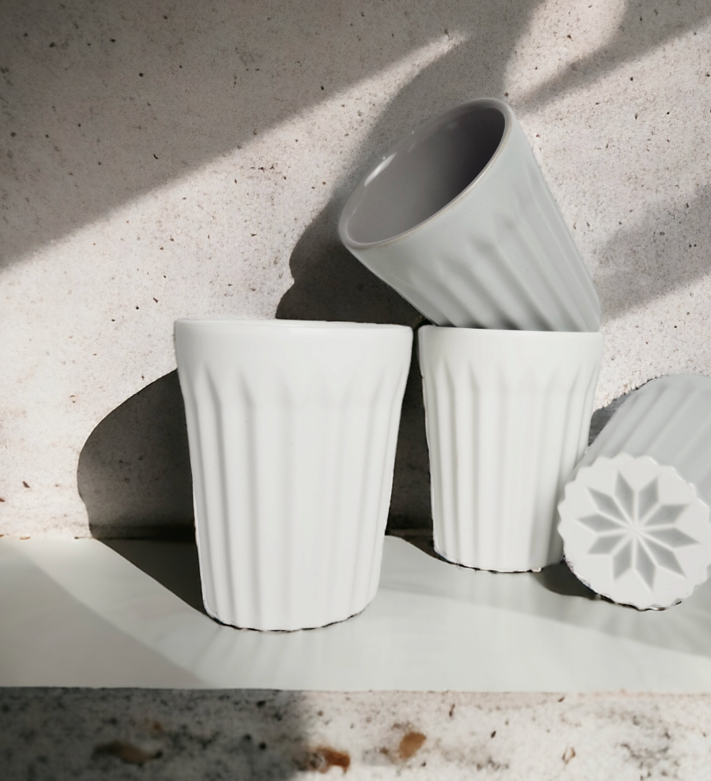 Modern matte grey ribbed ceramic latte cup with contemporary minimalist design
