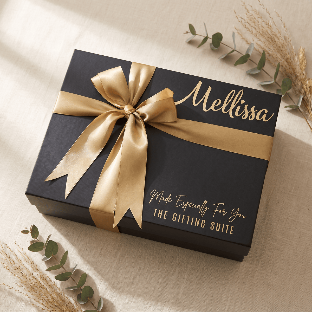 Black personalised gift box with gold ribbon and custom name